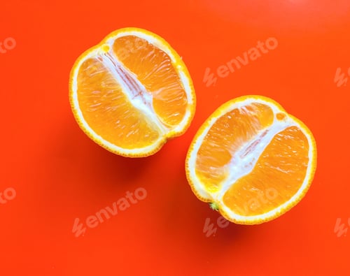 Preview: two halves of an orange on an orange background