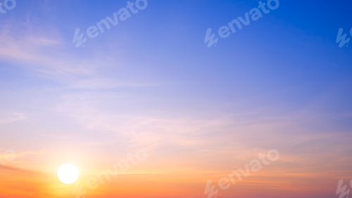 Preview: Sunrise sky background in the morning. Golden sun and cloud with gradient natural light on blue sky