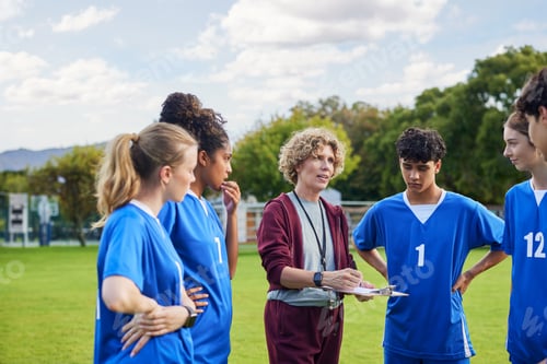 Preview: Coach explaining game plan to teens players in the field