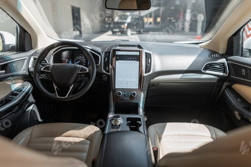 Preview: Modern car interior with steering wheel, display and front seats