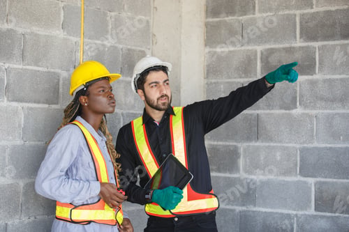 Preview: man caucasian engineers supervisors pointing forward and american african general employees