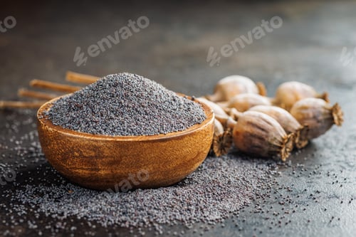Preview: Dry head and poppy seed in bowl on kitchen table.
