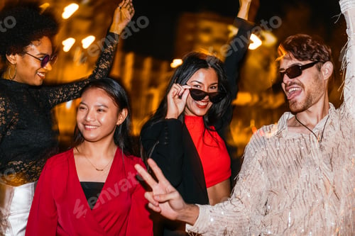 Preview: oyful Multicultural Friends Party at Night with Colorful Light Streaks