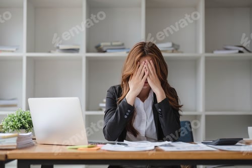 Preview: A stressed and serious young Asian businesswoman focuses on working on her business financial