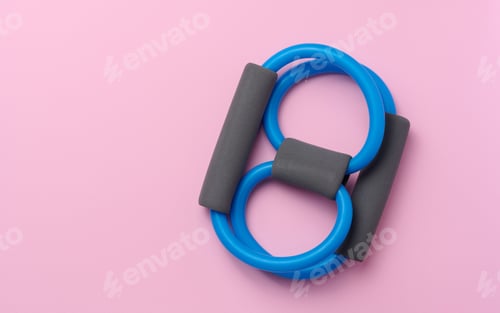 Preview: Rubber sports simulator expander on a pink background