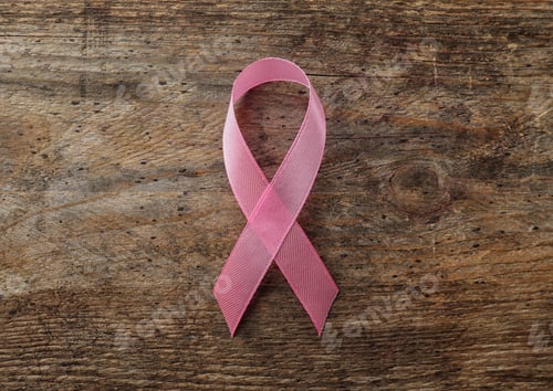 Preview: Pink ribbon on wooden background, top view. Breast cancer awareness concept