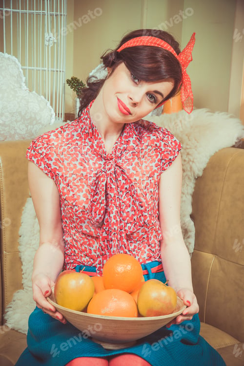 Preview: Girl Holding A Bowl Of Oranges