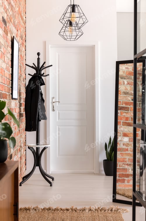 Preview: White and brick walled entrance hall interior in real photo with