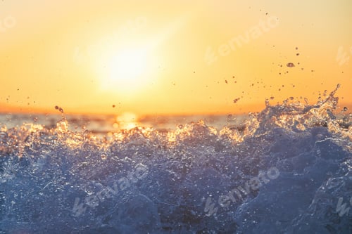 Preview: Ocean wave at summer sunrise, beautiful sunlight and sea foam