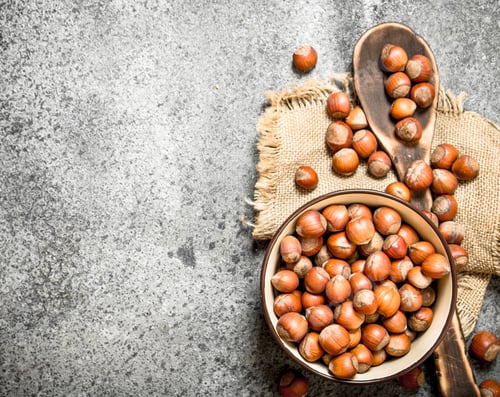 Preview: Bowl of Hazelnuts with Wooden Spoon