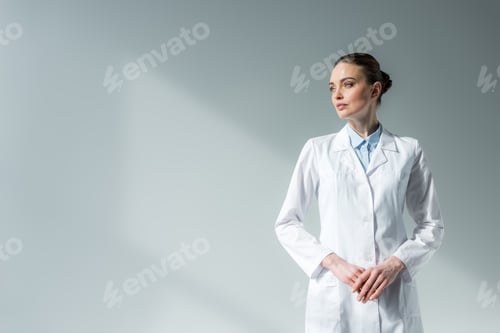 Preview: Serious Woman in Lab Coat in Studio