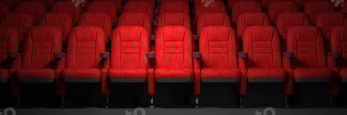 Preview: Red seats rows in empty cinema hall. Movie theatre and cinema concept.