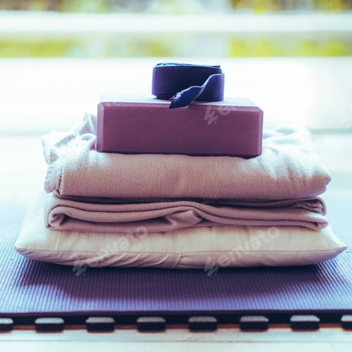 Preview: Yoga equipment placed on floor. Yoga mat, block, strap, blanket and pillow