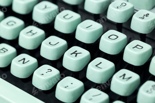 Preview: Close up of a vintage green typewriter keys. Selective focus