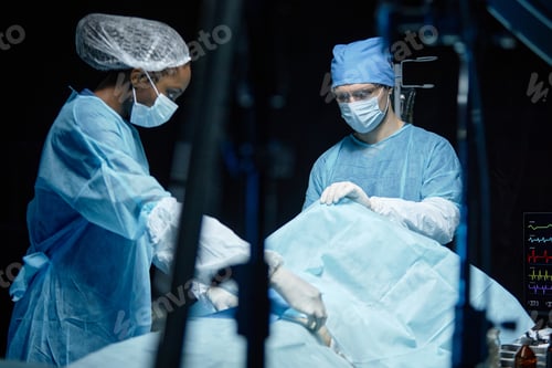 Preview: Two Surgeons in Operating Room Ready to Operate