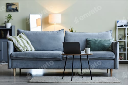 Preview: Minimal living room interior with laptop on coffee table