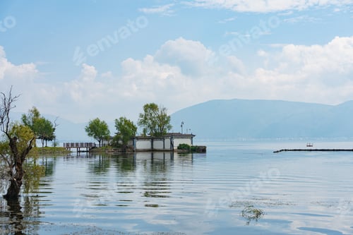 Preview: Tranquil Lake Scene with Island and Mountains