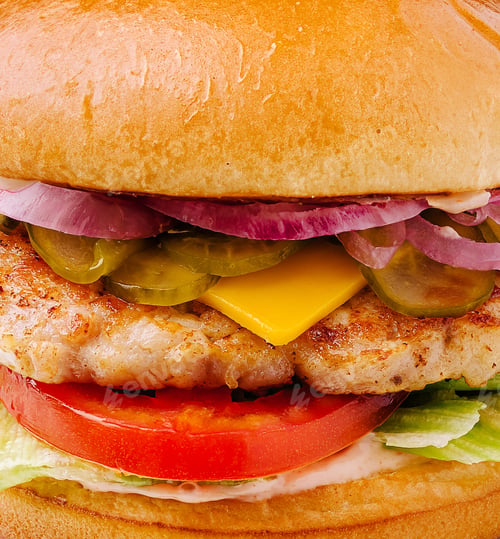 Preview: Delicious burger with chicken patty, cheese, and fresh vegetables