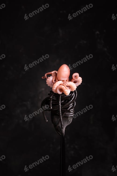 Preview: Black spaghetti with octopus on a fork