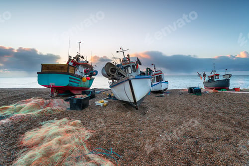 Preview: Fishing boats on the beach at dawn