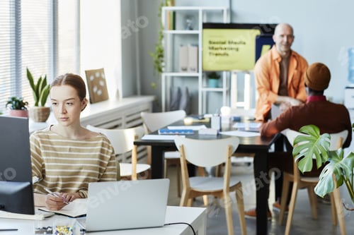 Preview: Young Woman Working In Office