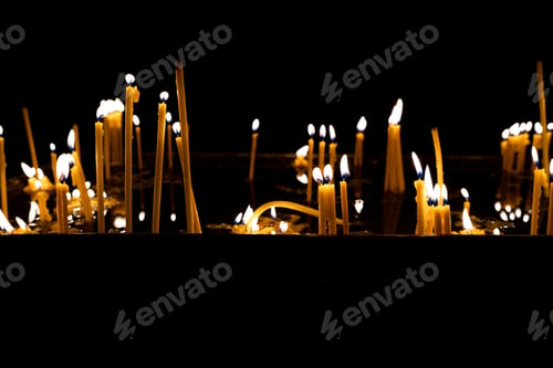 Preview: Lit church candles in the temple.