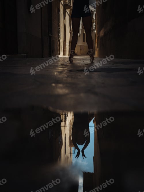Preview: Anonymous ballet dancer near puddle