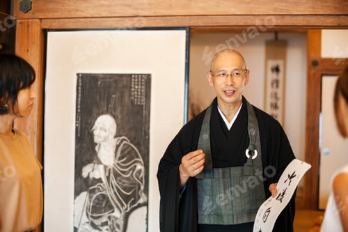 Preview: Two Japanese women and Buddhist priest standing in Buddhist temple, talking.