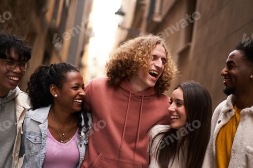 Preview: Group Of Happy Friends Having Fun Together Outdoors. Mixed race people laughing making community.