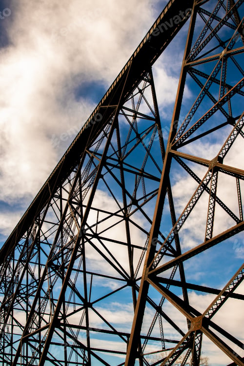 Preview: Low-angle shot of an industrical stucture on a cloudy sky