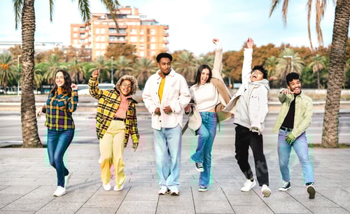 Preview: Multicultural friends walking at Barceloneta waterfront on funny moves
