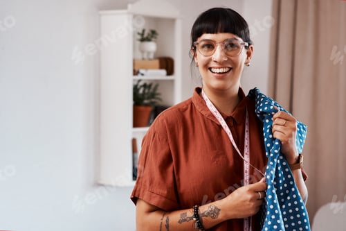 Preview: Im always busy with something new. Shot of a clothes maker posing with fabric at home.