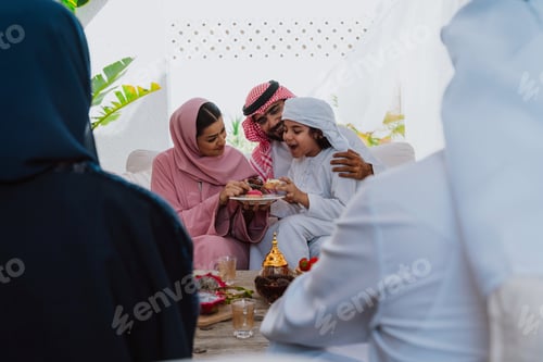 Preview: Emirati family at home. Muslim family sharing iftar at countryside home.
