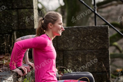 Preview: Couple, hands behind back doing push ups on stone steps, looking away smiling