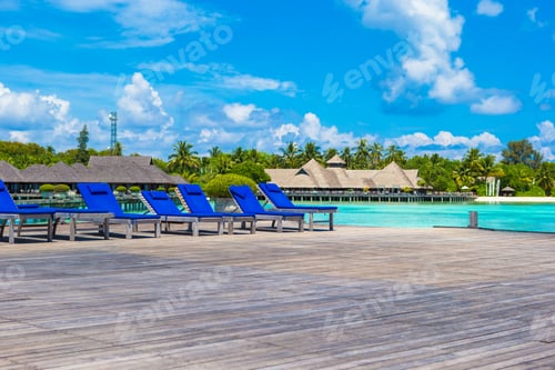 Preview: Wooden lounge chairs on on a wooden pier at Maldives