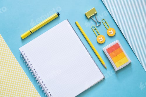 Preview: School supplies. Yellow and blue colors. Empty notebook. Flat lay composition. Space for text.