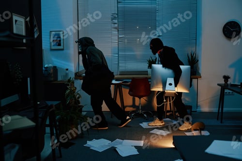 Preview: Two Young Adult Men Stealing Computer Equipment during Office Burglary at Night