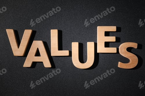 Preview: Word VALUES made of wooden letters on black background, flat lay