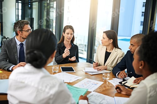Preview: Putting her ideas forward. Cropped shot of a group of businesspeople meeting in the boardroom.