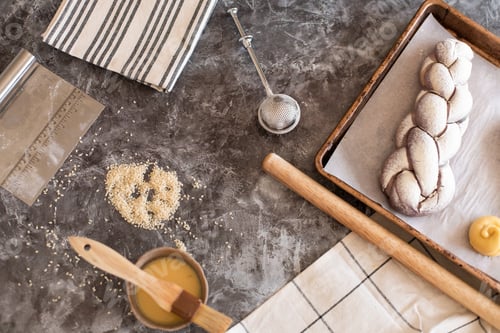 Preview: Purple challah on parchment paper. The process of preparing challah for baking.