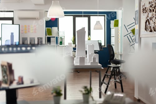 Preview: Empty architectural office with foam building model on table