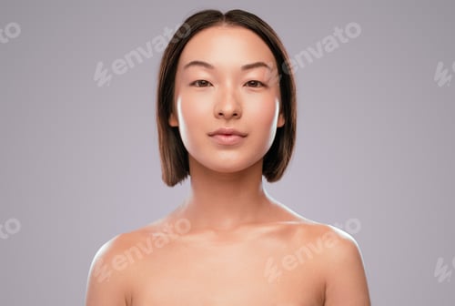 Preview: Chinese lady with clean skin looking at camera