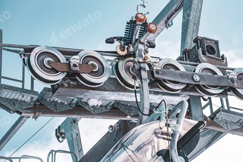 Preview: Ski lift system with skiers ascending snowy mountain slopes in Folgarida