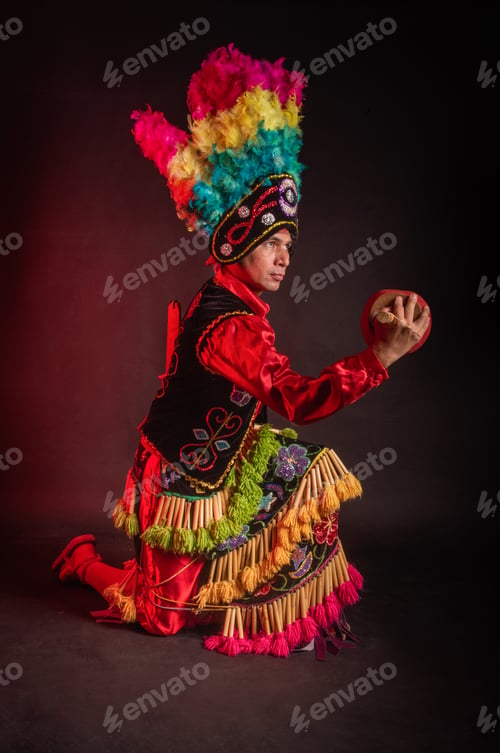 Preview: Matlachines Dancer from Coahuila Mexico A man in a colorful costume is holding a drum