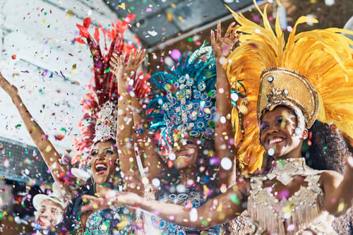 Preview: Cropped shot of beautiful samba dancers performing in a carnival with their band