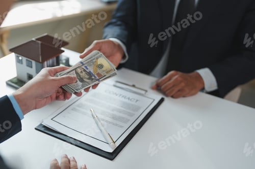 Preview: Businessman paying money for house purchase agreement
