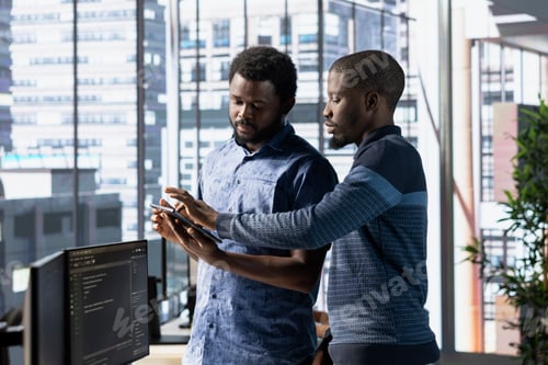 Preview: Teamworking IT coworkers in office transforming data into predictive models