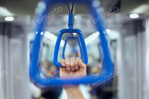 Preview: Hand holding handle in train