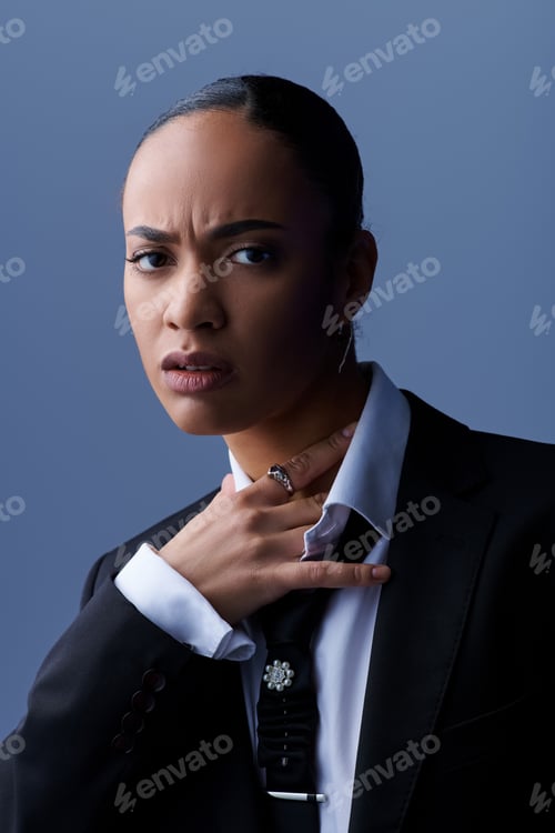 Preview: African American woman confidently poses in a stylish suit