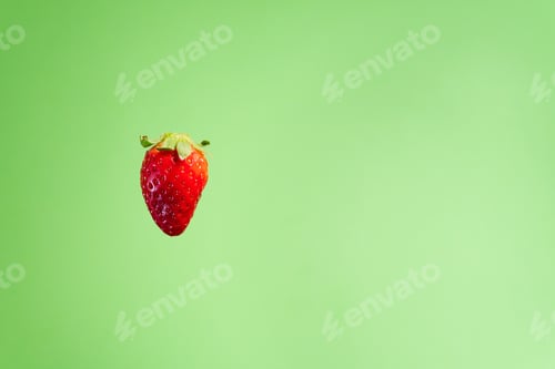 Preview: Sweet red strawberry isolated on a green background